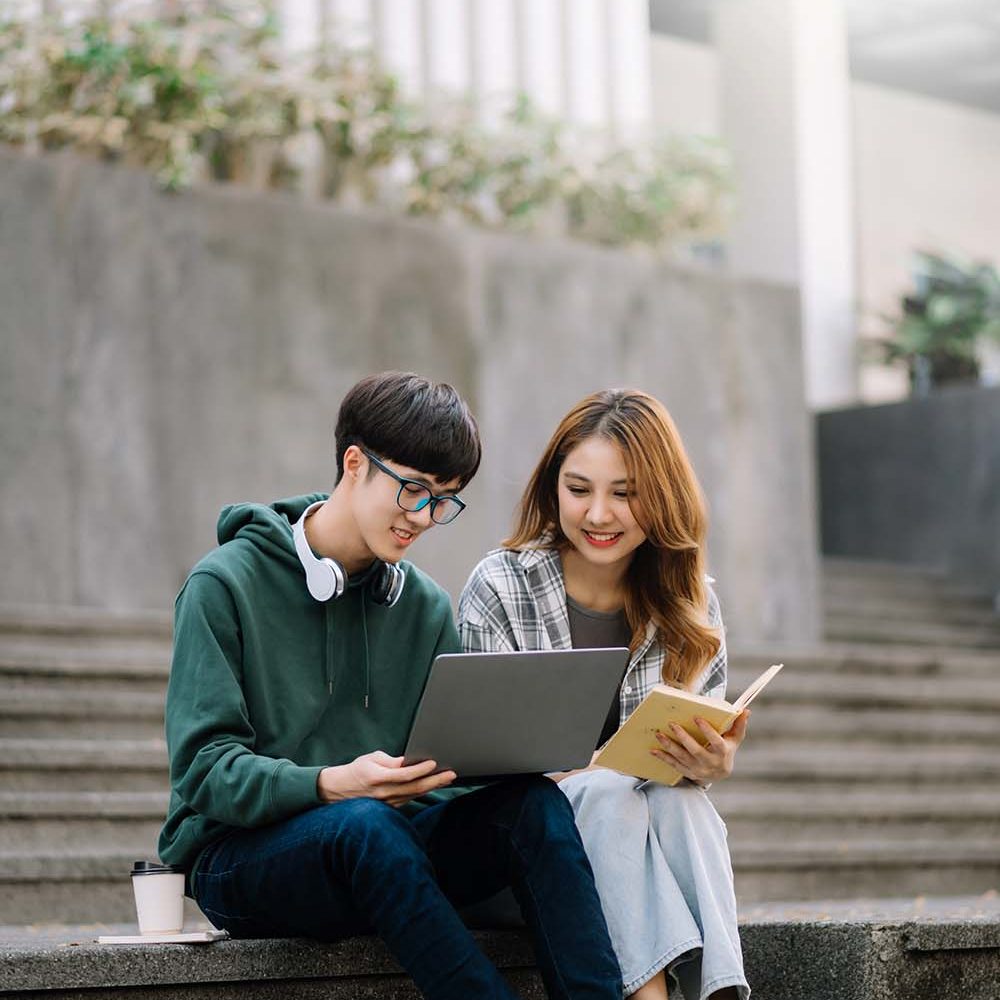 two-smart-young-asian-college-students-focusing-on-S7PPAGC.jpg